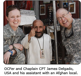 OCFer and Chaplain CPT James Delgado, USA and his assistant with an Afghan local.